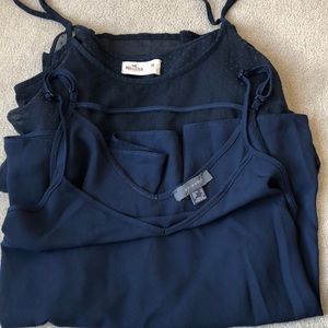 Two navy tank tops
